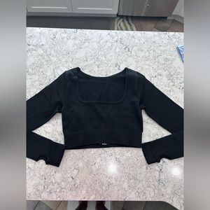 Black long sleeve tight shirt.